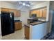 Spacious kitchen with a breakfast bar, stainless steel appliances, and ample cabinetry at 3330 S Gilbert Rd # 1003, Chandler, AZ 85286