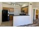 Open kitchen with stainless steel appliances and a breakfast bar at 3330 S Gilbert Rd # 1003, Chandler, AZ 85286