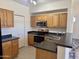 Well-appointed kitchen features stainless steel appliances, wood cabinetry, and modern countertops for cooking convenience at 3330 S Gilbert Rd # 1003, Chandler, AZ 85286