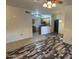 Spacious living room showcasing durable flooring, leading to the kitchen and other areas, perfect for comfortable living at 3330 S Gilbert Rd # 1003, Chandler, AZ 85286
