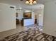 Bright living room featuring modern flooring and views into the kitchen at 3330 S Gilbert Rd # 1003, Chandler, AZ 85286