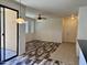 Open-concept living area with durable floors, connecting seamlessly to an outdoor patio, and a bright entryway at 3330 S Gilbert Rd # 1003, Chandler, AZ 85286