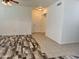 Bright, open-concept living area featuring durable flooring, fresh white paint, and ample natural light from windows at 3330 S Gilbert Rd # 1003, Chandler, AZ 85286
