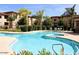 Resort-style pool and spa surrounded by lush landscaping and comfortable lounge chairs for relaxation and enjoyment at 3330 S Gilbert Rd # 1003, Chandler, AZ 85286