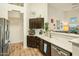 Bright kitchen with stainless steel appliances and a view of the open-concept living area, perfect for entertaining at 3921 W Sheffield Ave, Chandler, AZ 85226