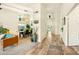 Bright living area showcasing wood floors, neutral walls, and open layout to the dining room for easy entertainment at 3921 W Sheffield Ave, Chandler, AZ 85226