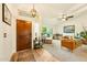 Warm living room with hardwood floors, a comfortable sofa, and plenty of natural light at 3921 W Sheffield Ave, Chandler, AZ 85226