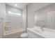 This bathroom features a tub-shower combo, a modern vanity, and a bright, neutral color scheme at 4119 S 176Th Dr, Goodyear, AZ 85338