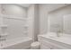 Bright bathroom features a tub-shower combo, modern vanity, and neutral finishes at 4119 S 176Th Dr, Goodyear, AZ 85338