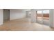 Spacious living room with tile floors, sliding glass door to the back patio and neutral color scheme at 4119 S 176Th Dr, Goodyear, AZ 85338