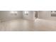 Bright living room area with tile floors, neutral paint, and views of the backyard through windows at 4119 S 176Th Dr, Goodyear, AZ 85338