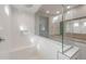 Shower featuring tiled walls, a bench, and glass at 4119 S 176Th Dr, Goodyear, AZ 85338