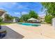 Backyard showcasing a sparkling pool and a shed surrounded by greenery, ideal for outdoor living at 4208 E Windsor Ave, Phoenix, AZ 85008