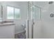 Bright bathroom featuring a glass enclosed shower and granite countertop vanity at 4208 E Windsor Ave, Phoenix, AZ 85008
