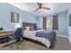 Comfortable bedroom with a ceiling fan, desk space, and neutral paint, perfect for relaxing or working at 4208 E Windsor Ave, Phoenix, AZ 85008