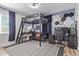 Unique bedroom features a loft bed, a desk, a gaming setup, and fun decor, creating a personal space at 4208 E Windsor Ave, Phoenix, AZ 85008