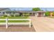Charming single-story home with a well-manicured lawn, updated garage door, and solar panels at 4208 E Windsor Ave, Phoenix, AZ 85008