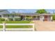 Charming single-story home with a well-manicured lawn, updated garage door, and solar panels at 4208 E Windsor Ave, Phoenix, AZ 85008