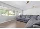 Comfortable living room featuring a large sectional sofa and neutral colors at 4208 E Windsor Ave, Phoenix, AZ 85008