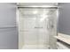 Modern tiled bathroom with glass door shower stall featuring updated fixtures and a bright, clean design at 461 W Holmes Ave # 224, Mesa, AZ 85210