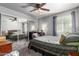 Bedroom featuring mirrored closet doors, ceiling fan, and neutral decor at 461 W Holmes Ave # 224, Mesa, AZ 85210
