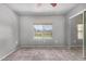 The bedroom has carpeted flooring, a ceiling fan, and a sliding glass door closet at 461 W Holmes Ave # 224, Mesa, AZ 85210