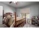 Bedroom with a four-poster bed and a tennis court view at 461 W Holmes Ave # 224, Mesa, AZ 85210