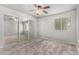 Neutral bedroom featuring soft carpet, ceiling fan and mirrored closet sliding doors at 461 W Holmes Ave # 224, Mesa, AZ 85210