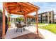 Community cabana area with ceiling fan, seating for dining and relaxing by the pool at 461 W Holmes Ave # 224, Mesa, AZ 85210