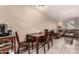 Open dining area featuring a dining table and tile flooring, blending into the living space at 461 W Holmes Ave # 224, Mesa, AZ 85210