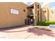The exterior view highlights the community's architecture and secure gated access, offering a safe, resort-style atmosphere at 461 W Holmes Ave # 224, Mesa, AZ 85210