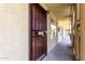Exterior door with security gate and unit number, offering secure and private entry to the condominium at 461 W Holmes Ave # 224, Mesa, AZ 85210