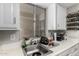 Bright kitchen featuring stainless steel sink and white cabinets at 461 W Holmes Ave # 224, Mesa, AZ 85210