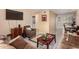 The living room has comfortable seating, a TV, and transitions into the dining area at 461 W Holmes Ave # 224, Mesa, AZ 85210