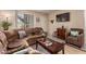 The living room features tile floors, a comfortable sofa, and modern television at 461 W Holmes Ave # 224, Mesa, AZ 85210