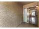 Outdoor patio with gray textured walls, ceramic tiled floors and a sliding glass door at 461 W Holmes Ave # 224, Mesa, AZ 85210