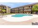Large community swimming pool with ample lounge seating provides a refreshing amenity for residents at 461 W Holmes Ave # 224, Mesa, AZ 85210
