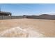 Spacious backyard with dirt and block wall at 4813 N 177Th Ln, Goodyear, AZ 85395