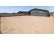 Wide shot of spacious backyard with dirt and block wall at 4813 N 177Th Ln, Goodyear, AZ 85395