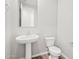 Stylish half bath featuring a pedestal sink and tile flooring at 4813 N 177Th Ln, Goodyear, AZ 85395