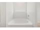 Modern soaking tub beneath a window, providing a peaceful bathing experience with natural light at 4813 N 177Th Ln, Goodyear, AZ 85395