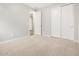 Neutral bedroom offering a closet and a doorway, providing a functional space for a comfortable living at 4813 N 177Th Ln, Goodyear, AZ 85395