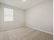 Bright, neutral bedroom features plush carpet, fresh paint and a window with blinds at 4813 N 177Th Ln, Goodyear, AZ 85395