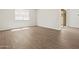 Bright bedroom with wood-style tile flooring and sliding glass doors at 4813 N 177Th Ln, Goodyear, AZ 85395