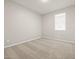 Neutral bedroom with carpet, a window with blinds, and modern outlets at 4813 N 177Th Ln, Goodyear, AZ 85395