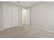 Neutral bedroom features plush carpet, sliding closet doors, and fresh paint at 4813 N 177Th Ln, Goodyear, AZ 85395