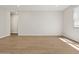 Bright, empty bedroom with wood-style tile flooring at 4813 N 177Th Ln, Goodyear, AZ 85395