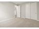 Cozy bedroom includes carpet, closet, and open doorway to the hall at 4813 N 177Th Ln, Goodyear, AZ 85395
