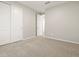 Bedroom with carpeted flooring, a closet with sliding doors, and neutral walls at 4813 N 177Th Ln, Goodyear, AZ 85395