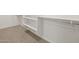 Walk in closet with carpeted floor and white shelving for organization at 4813 N 177Th Ln, Goodyear, AZ 85395